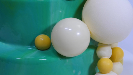 Stylish mousse cake with turquoise mirror glaze. Cake with turquoise mirror glaze decorated with chocolate balls.の写真素材