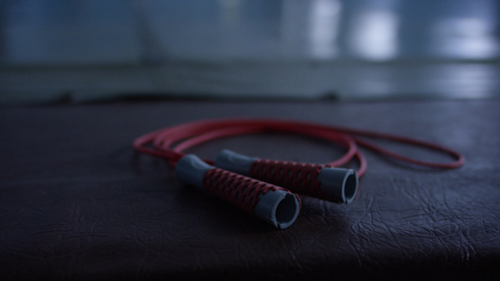 Jump rope lying on the floor, closeupの写真素材