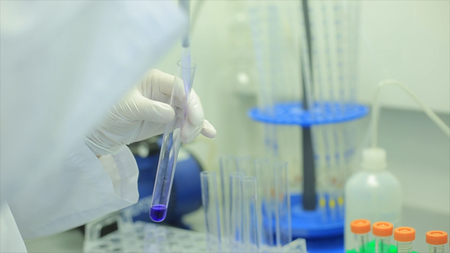 Test tubes closeup. Medical equipment. Close-up footage of a scientist using a micro pipette in a...