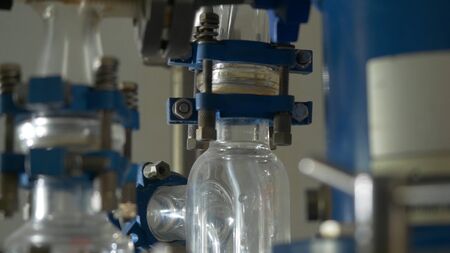Liquid flows through a transparent pipe. Experience in chemical laboratory.