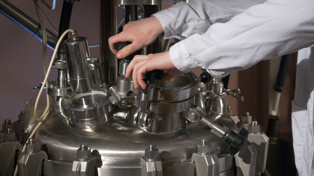 Medical specialist. Chemist opens the equipment