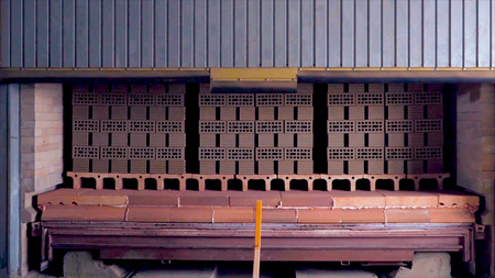 Plant for the production of bricks. Plant for production building material with ready brick, construction industrial. Production of bricks on plant. Workflow, close-up. Brick stacks. Many bricksの写真素材