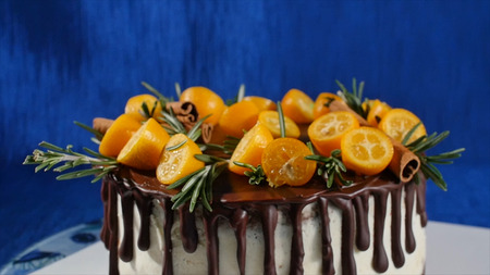 Front view of a biscuit cake. Pie with fruits and flowers. Close up front view cookie and cream cake. The chocolate cake and cookie cream decorated topping cocoaの写真素材