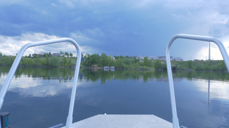 Ship Nose Front View boat at sea. view from motorboat. Elegant modern motor boat is at the dock in...