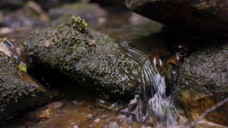 Water splash in river. Water in river close up with bubbles. Water bubbles floating on the surface...