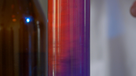 Scientist Pours Blue Pattern Chemicals Into In Flask. health care and medical concept. Scientist are certain activities on experimental science like mixing chemicalsの写真素材