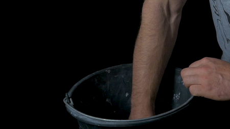 Talc sports. Closeup of a muscular man ready to workout. male powerlifter hand in talc and sports wristbands preparing to bench press. Hands in chalk. male powerlifter hand in talc and sports wristbands preparing to bench pressの写真素材
