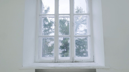 Blank white wall with window. Slide motion of movement or hitting the camera on empty light white room with window. Construction Home Empty room interior window aluminum on wall 4Kの写真素材