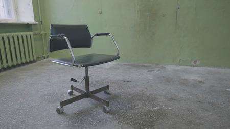 Vintage chair near old wall. Old red baroque chair to face a blank wall. Old chair against textured brick wall background 4Kの写真素材