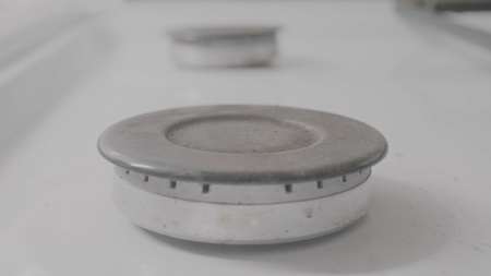 Burning gas plate on home kitchen stove. Modern Gas Stove Plate. Gas burner close up on home plate steel colorの写真素材