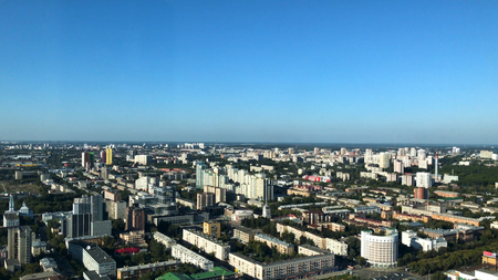 Yekaterinburg downtown aerial panorama. View of the city pond, historical center and Yekaterinburg-City district from the observation deck on the 52nd floor of Vysotsky skyscraper 4Kの写真素材