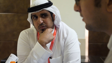 DUBAI, UAE - MAY 12, 2017: Dubai World Trade Centre, group of multi ethnic business people dealing a...