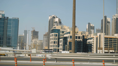 United Arab Emirates, Dubai - October 2017: Beautiful modern architecture Dubai, travel concept. View of the city from the car. View from the interior of the car on the streets of Dubaiのeditorial素材