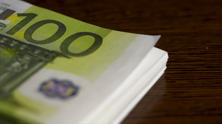 Euro coins money rain falling from sky isolated on black background financial business success concept. Time is money. Falling Euro banknotesの写真素材