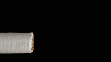 Ignite the lighter and light a cigarette. Close-up. High Dynamic Range. Slow motion pの写真素材