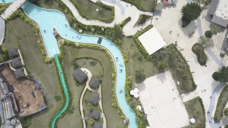 Top view of Swimming pools at tropical beach in luxury hotel. Video. Top view of a tourist hotel...