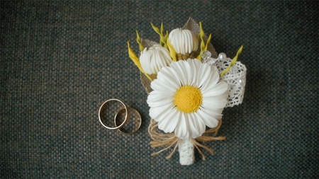 Engagement rings and wedding bouquet of flowers. Clip. Bouquet of flowers and beautiful wedding...