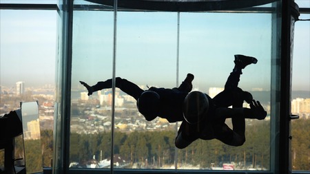 A group of persons trying the World's biggest free fall simulator, indoor skydiving Aero Gravity....