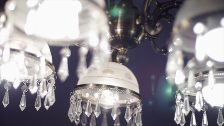Chrystal chandelier close up, selective focus. Clip. Chrystal chandelier close-up. Crystal chandelier close-up. Glamour background with copy spaceの写真素材