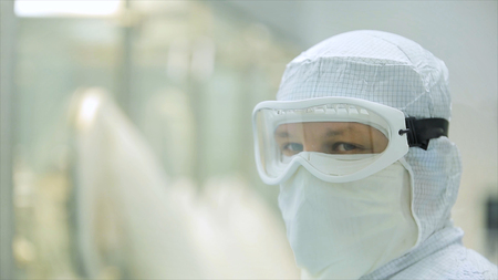 Pharmaceutics. Pharmaceutical worker operates blister packaging machine. Quality control. Pharmaceutics. Worker operator portraitの写真素材