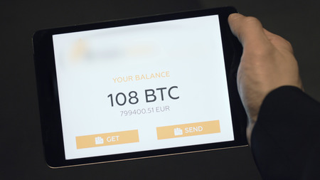 Tablet application showing the balance of a Bitcoin wallet. Stock. Digital currency concept. Balance...