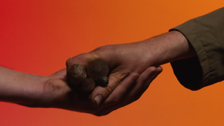 Concept of barter. Stock. The concept of barter and trust: the human hand giving a tool in the hand...
