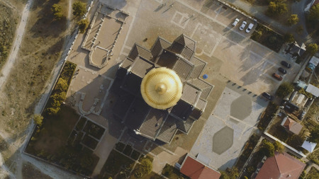 Top view on great christian church with golden dome. Shot. The dome of the Church in the center of the screen.の写真素材