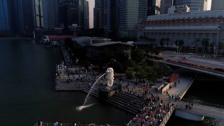 Marina Bay, Singapore May, 2018: View of business district and The Merlion Park. Moving clouds with Singapore city background. Shot. The Merlion is national personification of Singapore. Top view of fountain in Park in Singaporeのeditorial素材