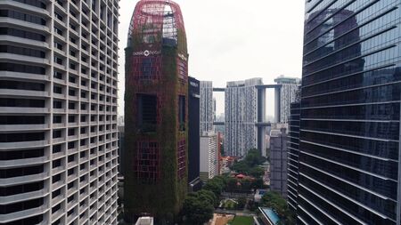 Singapore - August, 2018: View of high rise office skyscrapers and private residential blocks at...