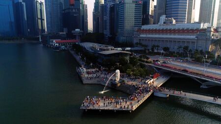 Singapore - August, 2018: View of central Singapore. Shot. Merlion lion fountain sculpture and financial towers on backgroundのeditorial素材