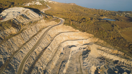 Panoramic view of quarry. Shot. Top view of picturesque quarry located on coastal mountain near...