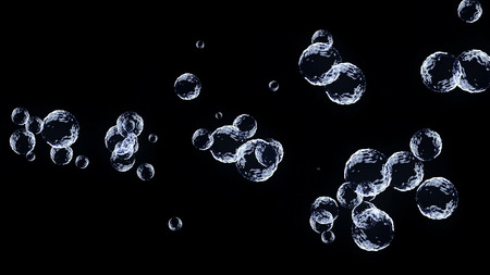Abstract flying transparent blue bubbles on black background. Shallow depth of field. Soap bubbles...