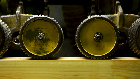 Close up of professional carpenter grinding wooden boards in workshop and lots of sawdust....