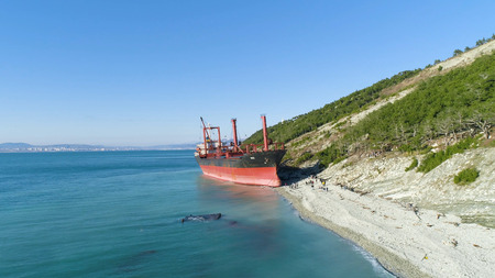 Famous abandoned wreck on the sea. Shot. Top view of an abandoned ship on the beachの写真素材
