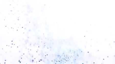 Powder paint in water. Close-up splash of falling powder paint particles in water on white isolated background.の写真素材