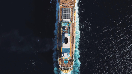 Bird eye top view of large cruiser ship in deep blue water in a sunny day, luxury concept. Stock....
