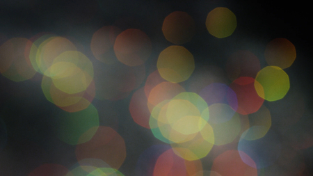 Bright magic colorful bokeh effect as background. Stock footage. Abstract blurred colored lights.