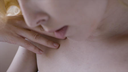 Female clavicles and neck. Action. Female clavicle. Perfect skin of a young woman close-up