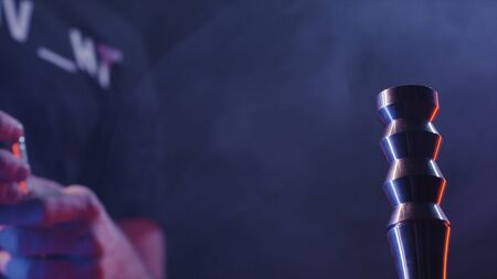 Close-up details of hookah. Action. Mens hands collect and twist details of hookah base on black isolated backgroundの写真素材