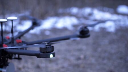 Close-up of quadcopter takes off. Clip. Powerful model of quadrocopter is new generation gaining...