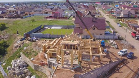 Top view of the process of building a wooden house. Clip. Small unfinished building with wooden...
