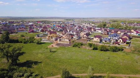 Aerial village with forest view at summer time with good weather. Clip. Top view of the village in...