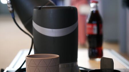 Close-up view of robot hand taking the coca-cola bottle at the robotics forum exhibition. Robots and innovative technologies in Russiaの写真素材