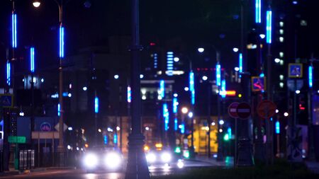 Futuristic city highway lights at night. Stock footage. Modern lighting with lanterns roads of metropolis at night. Futuristic lighting night highway creates impression of city of futureの写真素材
