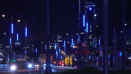 Neon lights on lights of night city. Stock footage. Night track of modern city is equipped with beautiful neon lights like in city of futureの写真素材