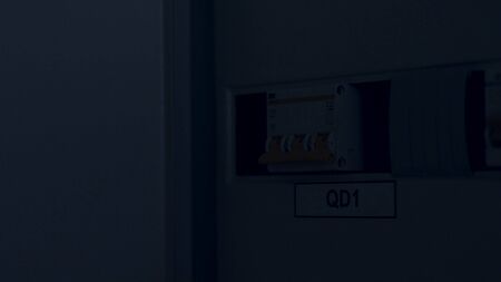 Close up of the man hand switching off and on automatic fuse, electric equipment concept. Stock footage. Male hand switching on and off the light in a box with automatic fuses.の写真素材