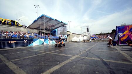 Yekaterinburg, Russia-August, 2019: Quad bike rider at moto festival. Action. Beautiful exciting performance of ATV rider on background of festival crowdのeditorial素材