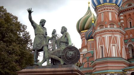 Russia, Moscow-September, 2019: Red square with St. Basils Cathedral on background of cloudy sky. Action. Beautiful and bright architecture of Moscow Kremlin with tower and templeのeditorial素材