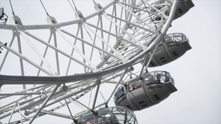 London, England - October, 2019: Big wheel cabins. Action. The London Eye is a giant Ferris wheel on the Thames River Embankment. Cabin of the Ferris wheel in Londonのeditorial素材