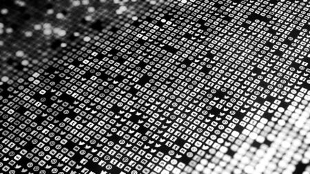 Editorial use only. Close up of social media app icons movings on black background, seamless loop....